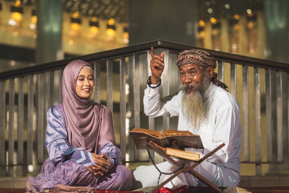 Foto sebuah mushaf Al-Quran yang terbuka di atas meja kayu di dalam perpustakaan klasik dengan cahaya hangat dari jendela, dikelilingi oleh tumpukan kitab-kitab kuning klasik karya ulama terdahulu.